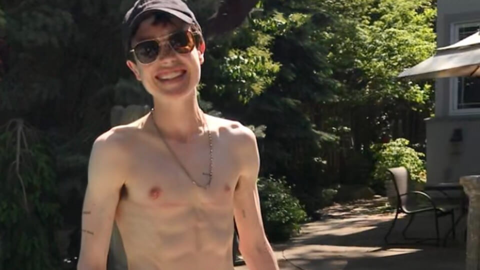 Elliot Page poses in a swimsuit after surgery