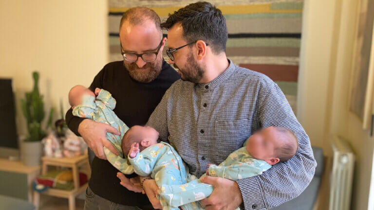 A gay couple adopts three triplet sisters